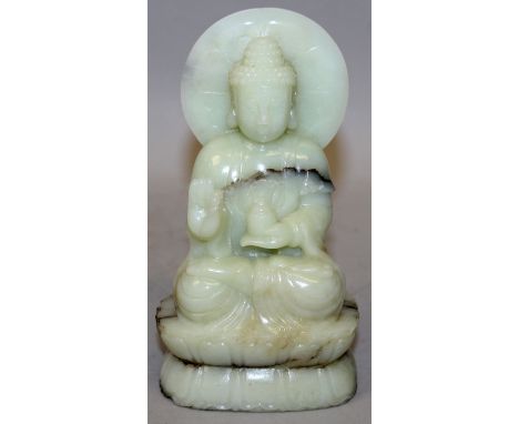 A 20TH CENTURY CHINESE CELADON JADE FIGURE OF BUDDHA, seated on a double lotus plinth, 6in high.