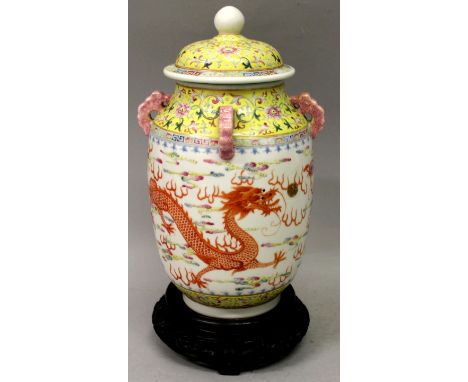 A GOOD CHINESE FAMILLE ROSE PORCELAIN DRAGON & PHOENIX VASE & COVER, the base with a six-character Guangxu mark in an unusual