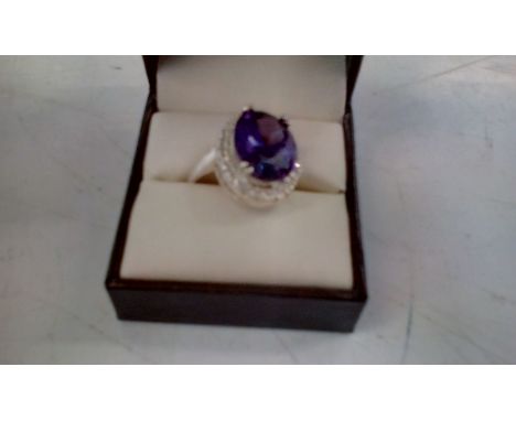 Silver dress ring set with purple stone, size Q