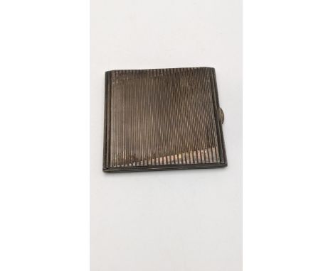 A silver cigarette case having a ribbed design hallmarked Birmingham 1933, 129.8gLocation: 