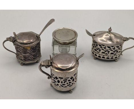 Three silver condiments all having a pierced design along with a crystal cut inkwell pot having a silver lid, total weight, e