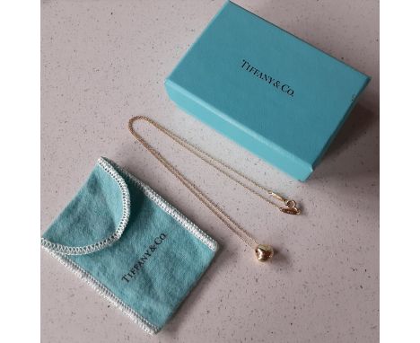 Tiffany & Co-An 18ct gold nugget charm on an 18ct gold chain stamped 750, 3.5g, together with turquoise branded slip case and