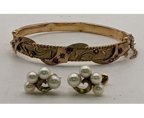 A pair of 15ct gold and pearl earrings, 4.4g, together with a 9ct gold floral style bangle set with ruby coloured stones, 7.6
