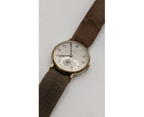A 1950s Smiths 9ct gold manual wind wristwatch, having an engraved case backLocation: 