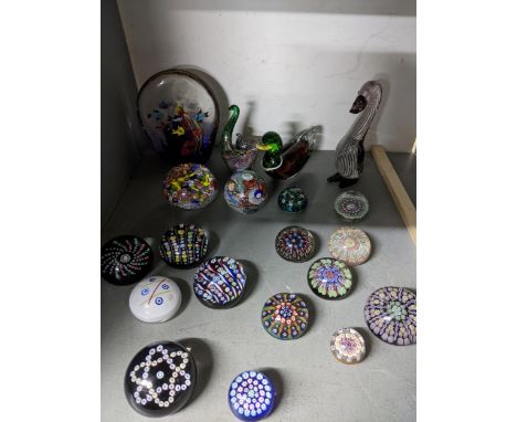 A group of Scottish and Murano glass paperweights to include Caithness limited edition and standard weights, Strathearn, and 