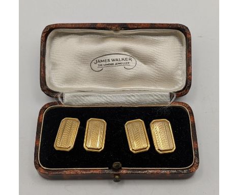 A pair of 9ct gold cufflinks having an engraved design, with chain links, and with a fitted box, 3.1gLocation: 
