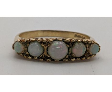 A 9ct gold opal ring set with five stonesLocation: 