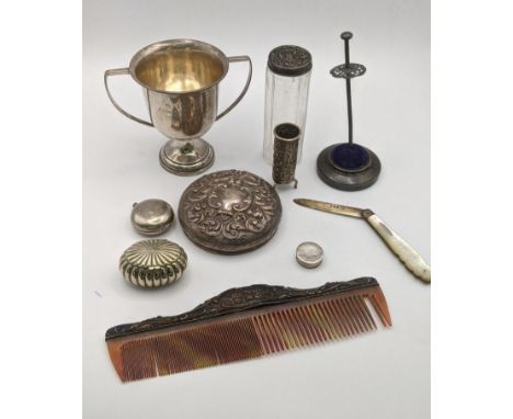 Mixed silver to include a trophy, dressing table items, trinkets, a silver and mother of pearl fruit knife and others, total 