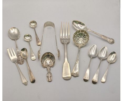 Mixed silver cutlery to include a fiddle pattern dinner fork, a pair of sugar tongs, a sugar sifter, a white metal caddy spoo