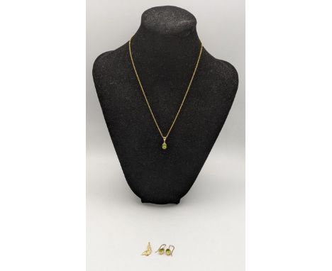 A pair of 9ct gold and peridot earrings together with a matching pendant 2.2g, on gold plated chain along with a pendant fash