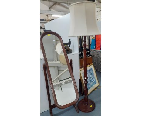 A mahogany standard lamp with reeded column and cream shade together with a mahogany cheval mirror. Location:A3B 