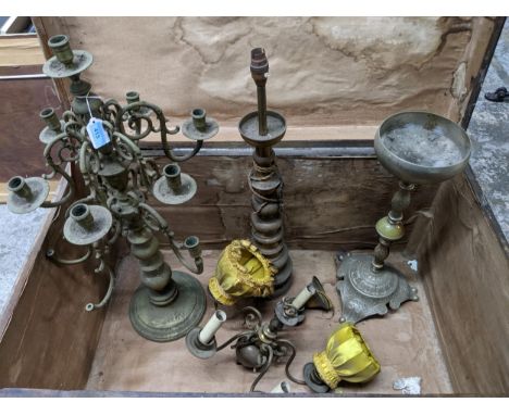 A mixed lot of metalware to include ceiling lights, brass candelabra, a small console table (lacking top), and other items Lo