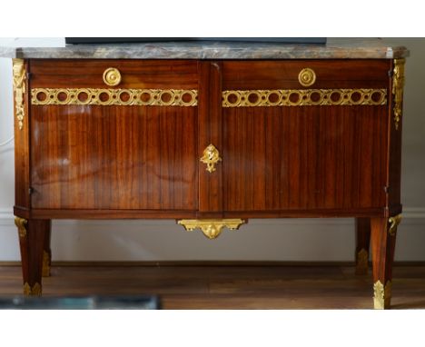 A Louis XVI style ormolu mounted, marble topped, walnut commode, 133cm wide x 88cm high. 