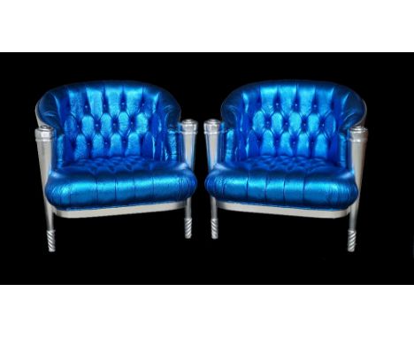 A pair of silver painted tub chairs with button back faux electric blue lizard skin upholstery on tapering supports, 79cm wid