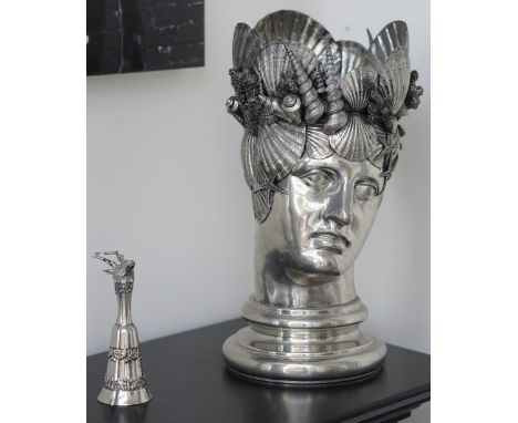 A white metal bust modelled as a wine cooler decorated with shells, 50cm high, a silver plated and glass claret jug, a two ti