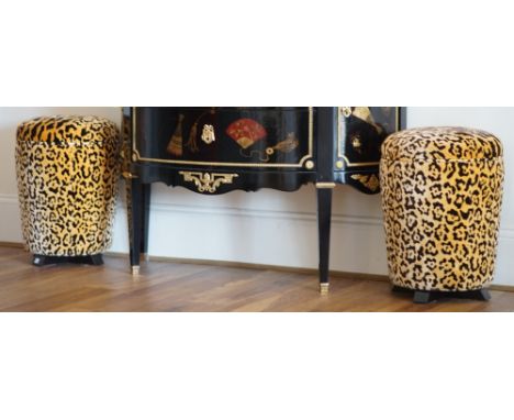 A pair of leopard print upholstered stools, of circular tapering form, 40cm diameter x 53cm high.