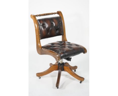 A modern stained beech office chair, with faux leather button back upholstery, 48cm wide x 87cm high.