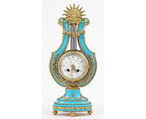 A Marie Antoinette style porcelain mantel clock with gilt metal mounts, detailed 'Kinables' to the foliate painted enamel dia