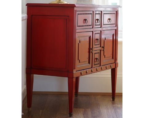 A Louis XVI style red lacquer commode, with an arrangement of various drawers, 91cm wide x 86cm high.