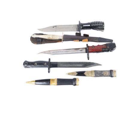 A No7 knife bayonet for the No 4 Rifle; an LIA3 knife bayonet for the "FAL" rifle; another knife bayonet; a copy of a first p