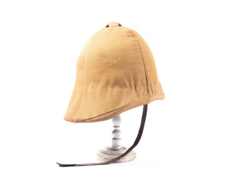 A scarce Victorian Boer War type foreign service helmet, complete with khaki cover bearing patch of 2nd Vol Batt. Lincolnshir