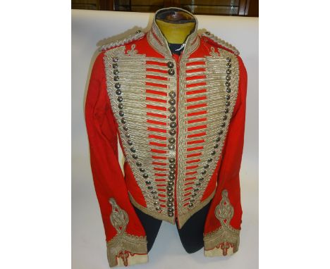 A fine Victorian Westmoreland and Cumberland Yeomanry officer's scarlet shell jacket, heavily decorated with silver braid fro