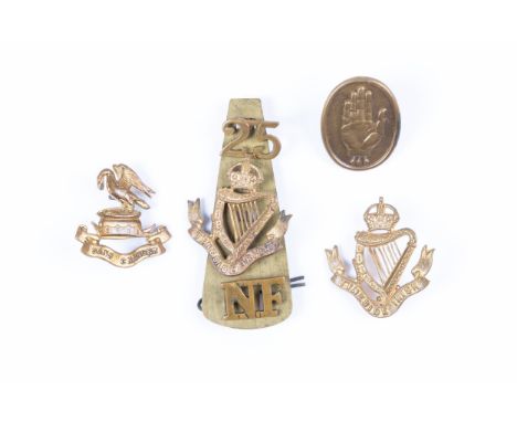 A WWI oval pale bronzed badge of the 36th Ulster Division, by Sharman D Niell Ltd, Belfast (one lug replaced); a 3 piece bras