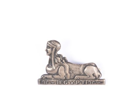 A white metal (silver?) sabretache badge of the 23rd Light Dragoons, c 1802, in the form of a female sphinx over a tablet wit
