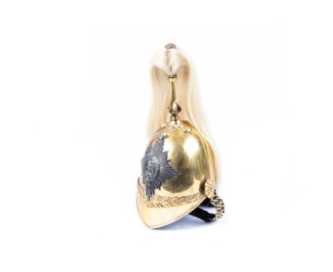 A Victorian 1871 pattern officer's helmet of the 6th Dragoon Guards (Carabiniers), with gilt skull, silver badge, chin chain,