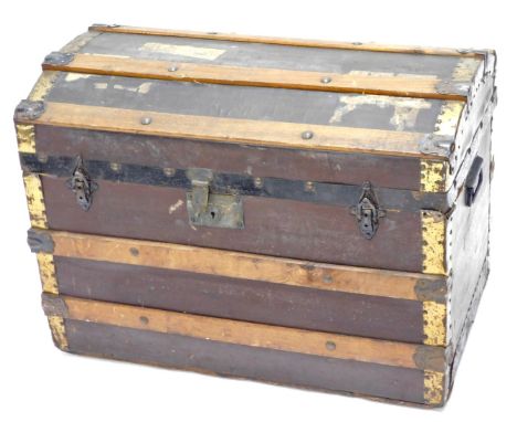 A canvas and wooden slatted trunk, with brass effect and ebonised iron mounts, 69cm wide. (AF) 