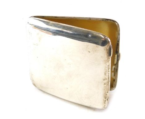 A late Edwardian silver cigarette case, of plain curved design, with silver gilt interior, Chester 1909, 2.85oz. 