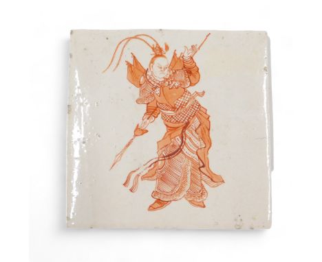 A 19thC ceramic tile, decorated with a Chinese style warrior in iron red, on a cream ground, indistinct mark to underside, 13