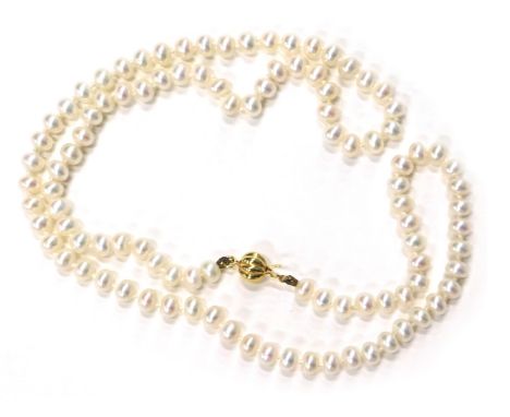A cultured pearl and crystal necklace, the cultured pearl necklace with orb clasp, yellow metal stamped 9ct, maker Jan Wightm