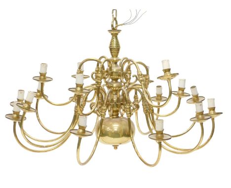 A brass Dutch style twelve branch chandelier, with stylised candle fitting, 100cm wide. 