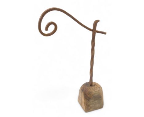 A wrought iron rush light, on wooden base, possibly 18thC, 38cm high. 