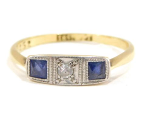 A sapphire and diamond Art Deco dress ring, the panel set with two square cut sapphires and a round brilliant cut diamond, in