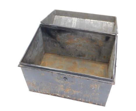 A black painted tin trunk, with a domed lid, 49cm high.
