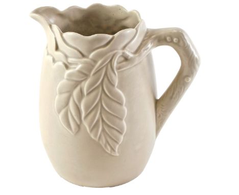A Clarice Cliff jug, moulded in relief with leaves, on a beige ground, printed marks in brown to underside, 19cm high. (AF) 