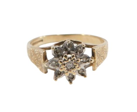 A 9ct gold cluster ring, set with czs in illusion setting, with raised mount, on star etched borders, ring size N, 2.2g all i