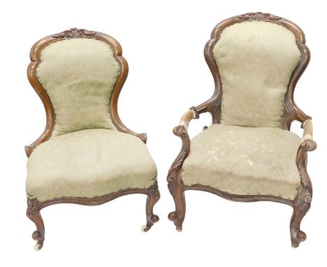 A Victorian walnut show frame armchair, with a padded back and seat, on cabriole legs with ceramic castors, and a matching nu