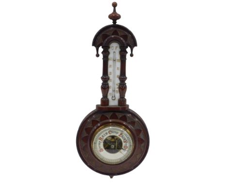 An early 20thC carved mahogany cased aneroid barometer, with opaque glass thermometer, 51cm high. 