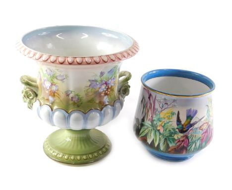 A Continental ceramic jardiniere, decorated with flowers, 29cm high, and a continental porcelain jardiniere painted with flow