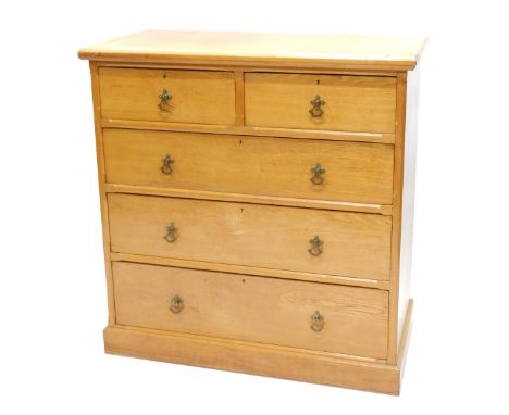 A Victorian ash chest of drawers, the rectangular canted top above an arrangement of two short and three long drawers, with g