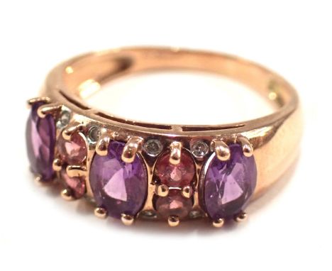 A 9ct rose gold dress ring, set with amethyst, pink topaz and cz, on half panelled design, ring size P, maker QVC, 3.1g all i