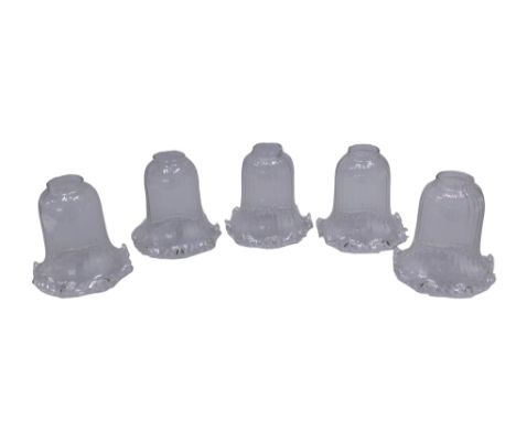 A collection of five clear glass ceiling light shades, with shaped edge. 