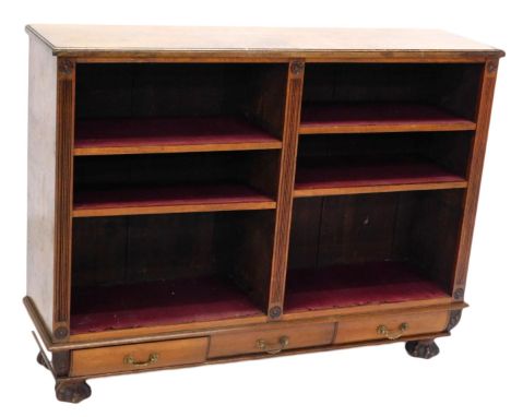 A late 19th/early 20thC walnut open bookcase, with adjustable shelves flanked by reeded pilasters, above three frieze drawers