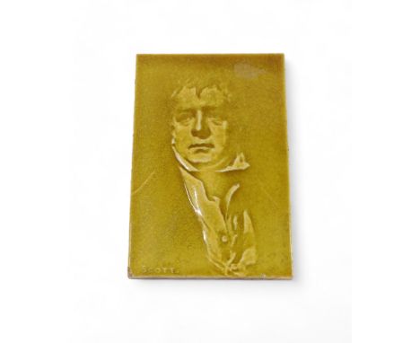 A 19thC ceramic tile, decorated with the face of Walter Scott, indistinctly stamped to underside PCD?, 15cm x 10cm.
