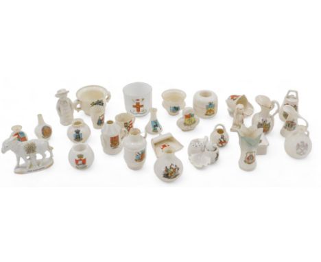 A quantity of crested china, to include novelty figures of a Peterborough dog, Isle of Wight match strike, Police lamp, etc. 