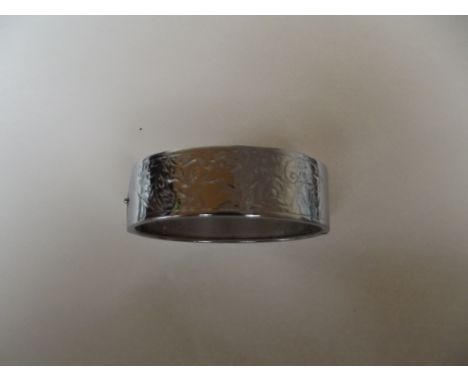 Broad silver hinged bangle