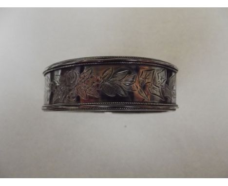 Broad silver hinged bangle
